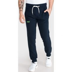 SuperDry Spodnie dresowe Niebieski. Niebieskie spodnie męskie Superdry, s, bez wzorów, z bawełny. Za 350,95 zł.