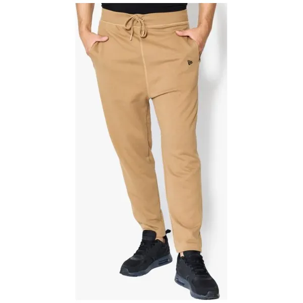 New Era Spodnie Originators Trk Pant Ne Khk , beżowy, rozmiar M. Brązowe spodnie męskie New Era, na spacer, m, w paski, z bawełny, klasyczne. W wyprzedaży za 149,99 zł.