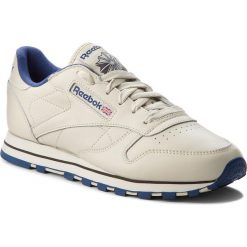 Buty Reebok - Cl Lthr 28413 Ecru/Navy. Brązowe półbuty damskie Reebok, bez wzorów, ze skóry, bez obcasa, na płaskiej podeszwie, bez zapięcia. W wyprzedaży za 249,00 zł.
