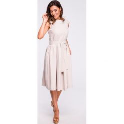 Sukienka rozkloszowana bez rękawów beżowa - 2xl. Brązowe sukienki damskie e-margeritka.pl, s, bez wzorów, z poliesteru, eleganckie, bez kołnierzyka, z długim rękawem, długie, mini, rozkloszowane. Za 184,99 zł.