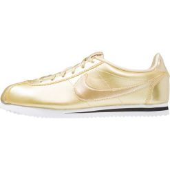 Nike Sportswear CORTEZ SE Tenisówki i Trampki metallic gold star. Żółte trampki chłopięce Nike Sportswear, z materiału. W wyprzedaży za 263,20 zł.