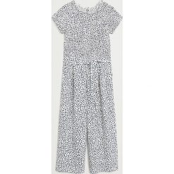 Mango Kids - Kombinezon dziecięcy Lyn 110-164 cm. Białe kombinezony dziewczęce Mango Kids, w kwiaty, z elastanu, z długim rękawem, długie. Za 119,90 zł.