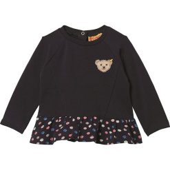 Bluza w kolorze czarnym ze wzorem. Czarne bluzy niemowlęce Steiff, z aplikacjami, bez rękawów, bez kaptura. W wyprzedaży za 58,95 zł.