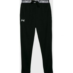 Under Armour - Spodnie dziecięce 127-170 cm. Czarne legginsy dziewczęce Under Armour, bez wzorów, z poliesteru, sportowe. W wyprzedaży za 99,90 zł.