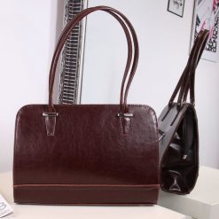Torebka skórzana kuferek DAN-A T302 koniak - koniak. Kuferki damskie DAN-A, bez wzorów, ze skóry, eleganckie, bez dodatków. Za 259,99 zł.