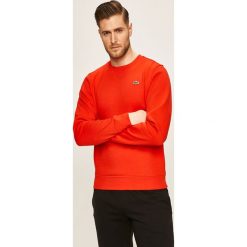 Lacoste - Bluza. Pomarańczowe bluzy męskie Lacoste, s, bez wzorów, z elastanu, z okrągłym kołnierzem, bez rękawów, bez kaptura. W wyprzedaży za 239,90 zł.