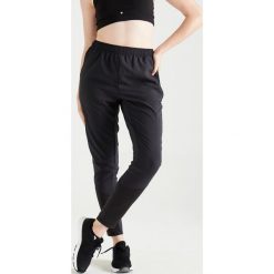Spodnie cardio fitness 100 damskie. Czarne spodnie damskie DOMYOS, xl, bez wzorów, z elastanu, na fitness i siłownię. Za 69,99 zł.