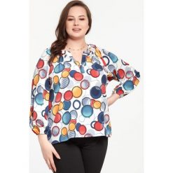 Bluzka Cyntia w kolorowe kółka XXL OVERSIZE. Bluzki damskie Moda Size Plus Iwanek, na imprezę, xxl, bez wzorów, z elastanu, eleganckie, z asymetrycznym kołnierzem, bez rękawów. Za 99,00 zł.