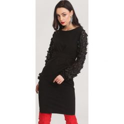 Czarna Sukienka Melting. Czarne sukienki damskie marki other, w paski, z dzianiny, z okrągłym kołnierzem, bez rękawów, długie, mini, dopasowane. Za 79,99 zł.
