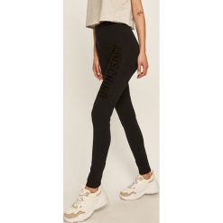 Moschino Underwear - Legginsy. Czarne spodnie damskie Moschino Underwear, s, z aplikacjami, z elastanu. Za 659,90 zł.