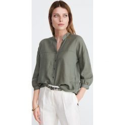 Bawełniana koszula oversize - Khaki. Brązowe koszule damskie Reserved, bez wzorów, z bawełny, bez kołnierzyka, bez rękawów. W wyprzedaży za 49,99 zł.