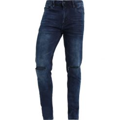 Cristiano Ronaldo CR7 TYPE SRAW SEAM Jeansy Slim Fit blue shade. Niebieskie jeansy męskie relaxed fit marki Cristiano Ronaldo CR7. Za 379,00 zł.