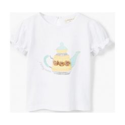 Mango Kids - Top dziecięcy Tajin 80-104 cm. Białe bluzki dziewczęce marki Mango Kids, z nadrukiem, z bawełny, z okrągłym kołnierzem. W wyprzedaży za 29,90 zł.