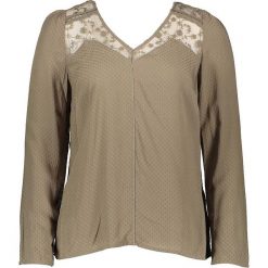 Bluzka "Hevinus" w kolorze khaki. Brązowe bluzki damskie NAF NAF, z aplikacjami, klasyczne, bez kołnierzyka, bez rękawów. W wyprzedaży za 59,95 zł.