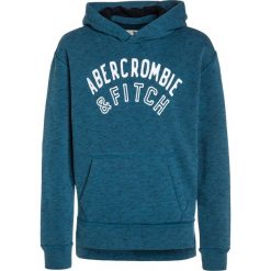 Abercrombie & Fitch CORE Bluza z kapturem blue. Niebieskie bluzy chłopięce marki Abercrombie & Fitch, z bawełny, z kapturem. W wyprzedaży za 143,20 zł.