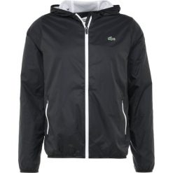 Lacoste Sport TENNIS WIND JACKET Kurtka sportowa black/white. Czarne kurtki sportowe męskie Lacoste Sport, m, z materiału. Za 669,00 zł.
