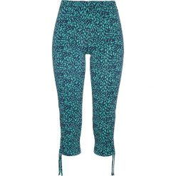 Legginsy bonprix ciemnoniebiesko-szmaragdowy z nadrukiem. Niebieskie spodnie damskie bonprix, z nadrukiem. Za 27,99 zł.