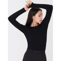 Sweter z guzikami - Czarny. Czarne swetry damskie House, s, bez wzorów, bez rękawów, bez kaptura. Za 59,99 zł.