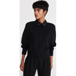 Bluza z ozdobnym kołnierzykiem - Czarny. Czarne bluzy damskie Reserved, s, bez wzorów, bez rękawów, bez kaptura. Za 89,99 zł.