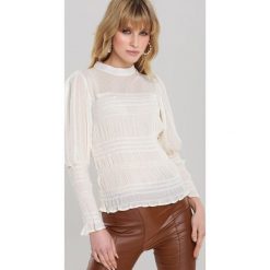 Jasnobeżowa Bluzka Layan. Brązowe bluzki damskie Renee, s, z haftami, z jeansu, eleganckie. Za 109,99 zł.