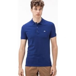 Koszulka polo w kolorze niebieskim. Niebieskie koszulki męskie Lacoste, s, z haftami, klasyczne, bez rękawów. W wyprzedaży za 259,95 zł.