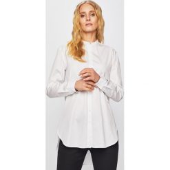 Tommy Hilfiger - Koszula. Białe bluzki damskie TOMMY HILFIGER, na co dzień, s, bez wzorów, z bawełny, bez kołnierzyka, z długim rękawem. W wyprzedaży za 359,90 zł.