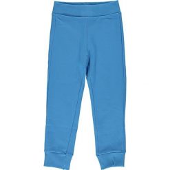 Spodnie dresowe w kolorze niebieskim. Niebieskie dresy chłopięce marki Benetton, z bawełny. W wyprzedaży za 22,95 zł.