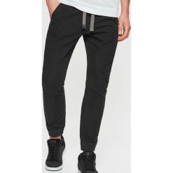 Jeansy SLIM JOGGER - Czarny. Czarne jeansy męskie marki Cropp. Za 119,99 zł.