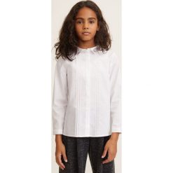 Mango Kids - Koszula dziecięca Neck 110-164 cm. Białe bluzki dziewczęce Mango Kids, bez wzorów, z bawełny, z klasycznym kołnierzykiem, z długim rękawem, długie, bez kaptura. W wyprzedaży za 59,90 zł.