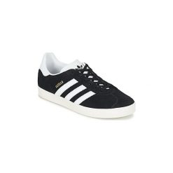 Buty Dziecko adidas GAZELLE J. Czarne trampki dziewczęce Adidas, bez wzorów, bez zapięcia. Za 242,10 zł.