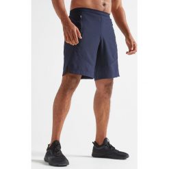 Spodenki fitness kardio FST 500 męskie. Niebieskie spodenki sportowe męskie DOMYOS, m, bez wzorów, z elastanu, sportowe, na fitness i siłownię. Za 59,99 zł.