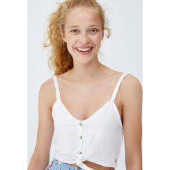 Top z węzłem z przodu. Niebieskie topy damskie marki Pull&Bear. Za 49,90 zł.