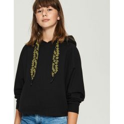 Bluza z nadrukiem Batman - Czarny. Czarne bluzy damskie z nadrukiem marki Sinsay, s. Za 69,99 zł.