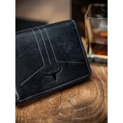 Portfel męski skórzany RFID Buffalo Wild granatowy - Niebieski. Niebieskie portfele męskie BUFFALO WILD, bez wzorów, ze skóry. Za 69,99 zł.