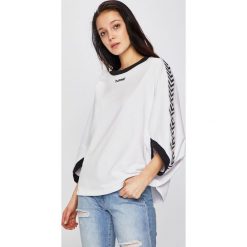 Hummel - Bluza. Białe bluzy damskie Hummel, s, z nadrukiem, z bawełny, bez rękawów, bez kaptura. W wyprzedaży za 179,90 zł.