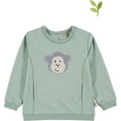 Bluza w kolorze miętowozielonym. Zielone bluzy niemowlęce Mother Nature & Me, z aplikacjami, z bawełny, bez rękawów, bez kaptura. W wyprzedaży za 54,95 zł.