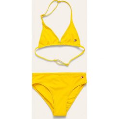 Tommy Hilfiger - Strój kąpielowy dziecięcy 104-164 cm. Żółte stroje kąpielowe dziewczęce TOMMY HILFIGER, bez wzorów, z elastanu. Za 159,90 zł.