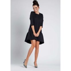Czarna Wizytowa Sukienka o Kroju Litery A z Falbanką. Czarne sukienki damskie Molly.pl, na co dzień, s, bez wzorów, z dzianiny, eleganckie, z falbankami, bez rękawów, proste. Za 153,90 zł.
