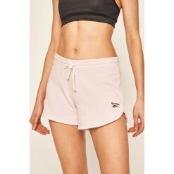 Reebok - Szorty. Różowe spodenki sportowe damskie Reebok, s, bez wzorów, z bawełny, sportowe. Za 89,90 zł.