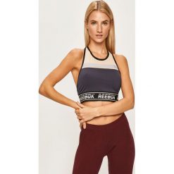 Reebok - Biustonosz sportowy. Niebieskie biustonosze sportowe damskie Reebok, l, bez wzorów, z elastanu. W wyprzedaży za 89,90 zł.