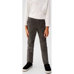 Mango Kids - Spodnie dziecięce Austria 110-164 cm. Niebieskie spodnie chłopięce Mango Kids, bez wzorów, z elastanu, casualowe. W wyprzedaży za 49,90 zł.