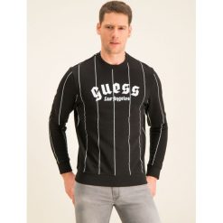 Bluza Guess M01Q53 K9FM0. Czarne bluzy męskie Guess, xl, z aplikacjami, z bawełny, bez kołnierzyka, bez rękawów, bez kaptura. W wyprzedaży za 239,00 zł.
