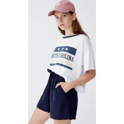 Koszulka „South Carolina”. Szare koszulki damskie marki Pull&Bear, bez wzorów, bez kołnierzyka. Za 49,90 zł.