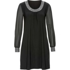 Sukienka z aplikacją ze sztrasów bonprix czarny. Czarne sukienki balowe marki bonprix, z aplikacjami, z dżerseju, z okrągłym kołnierzem. Za 129,99 zł.