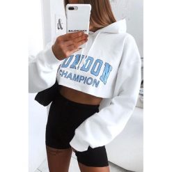 Bluza damska MIKONA. Białe bluzy sportowe damskie Bluza damska MIKONA, s, bez wzorów, z krótkim rękawem, krótkie, bez kaptura. W wyprzedaży za 79,00 zł.