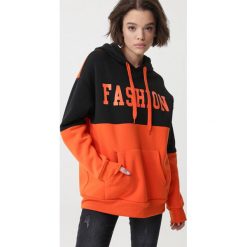 Pomarańczowa Bluza Lindisfarne. Pomarańczowe bluzy damskie Born2be, xl, z napisami, z dzianiny, długie. Za 109,99 zł.