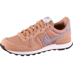 Sneakersy "Internationalist" w kolorze pomarańczowym. Pomarańczowe sneakersy damskie Nike Women, z materiału. W wyprzedaży za 204,95 zł.