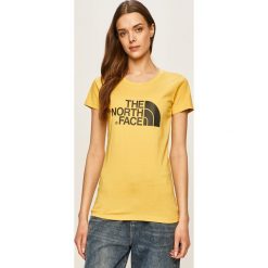 The North Face - T-shirt. Żółte bluzki damskie The North Face, s, z nadrukiem, z bawełny, casualowe, z okrągłym kołnierzem. W wyprzedaży za 99,90 zł.
