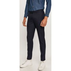 Scotch & Soda - Spodnie. Niebieskie spodnie męskie Scotch & Soda, bez wzorów, z elastanu. Za 429,90 zł.