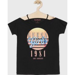 Guess Jeans - Top dziecięcy 118-175 cm. Białe bluzki dziewczęce Guess Jeans, z nadrukiem, z elastanu, z okrągłym kołnierzem, z krótkim rękawem, krótkie, bez kaptura. Za 99,90 zł.